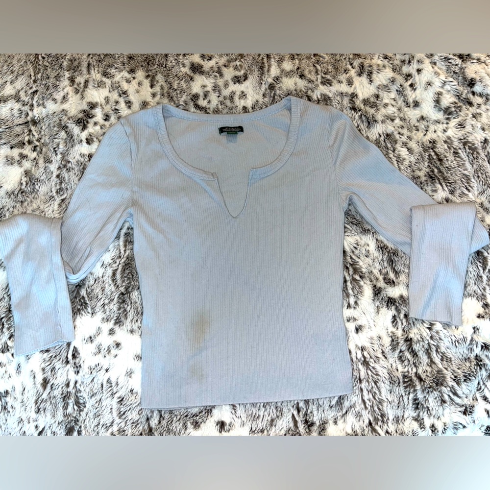 blue long sleeve shirt size xs with a small stain on the bottom left